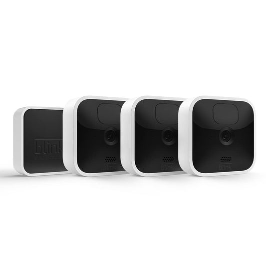 Blink Indoor Kabellose HD Sicherheitskamera – 3er-System: Drei kompakte, weiße Kameras für drahtlose HD-Videoüberwachung im Eigenheim.