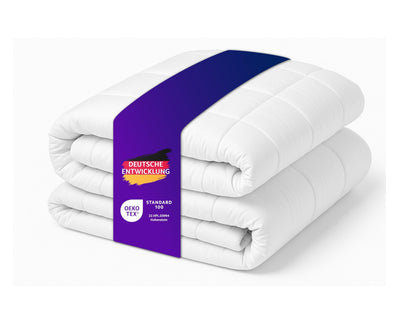 Traumnacht Entspannungsdecke Gewichtsdecke – 9kg, 155x220cm. Rechteckige, graue Decke, die durch mikrofeine Glasperlen Tiefenstimulation zur Entspannung bietet.