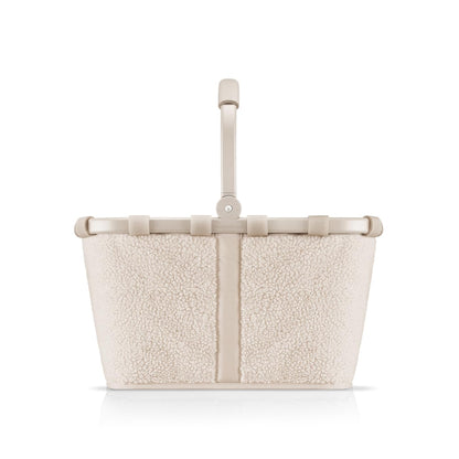 reisenthel carrybag teddy stabiler Einkaufskorb - sand. Rechteckiger Korb in Sand, Teddy-Optik, mit Tragegriff zum Transport von Einkäufen.
