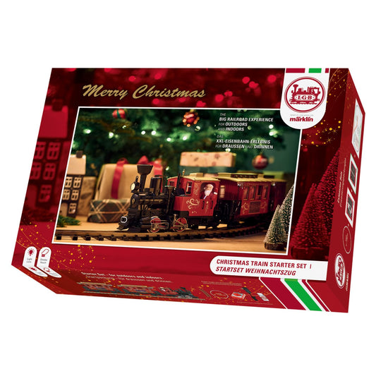 LGB 70308 Gartenbahn Starterset - Weihnachtszug Spur G. Roter Zug mit Lok und Waggons auf ovalem Gleis. Komplettset für G-Spur Gartenbahn.