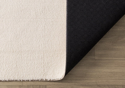 the carpet Relax Felloptik Teppich - Beige 240x340 cm